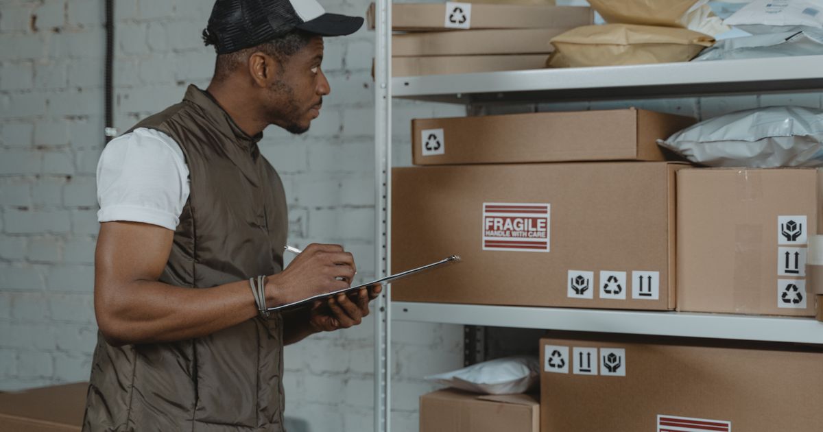 Person checking boxes for delivery