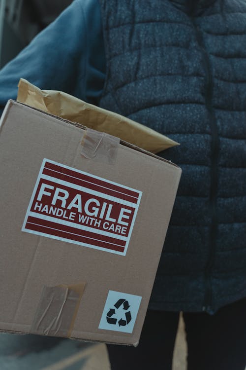 Free A Person Delivering a Package Stock Photo