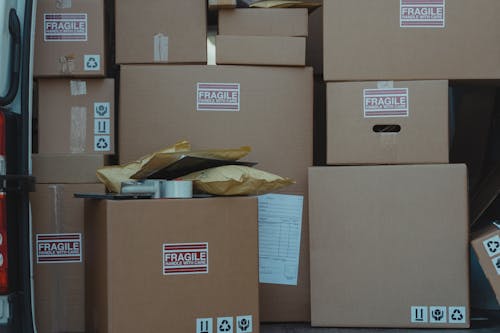 Close-up Photo of Stacked Carton Boxes