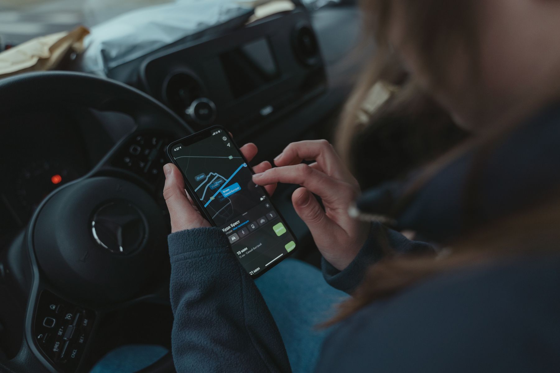 A person using GPS navigation on a smartphone to find directions