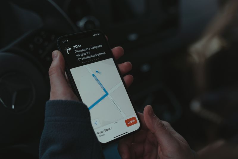 Smartphone showing a navigation app while traveling