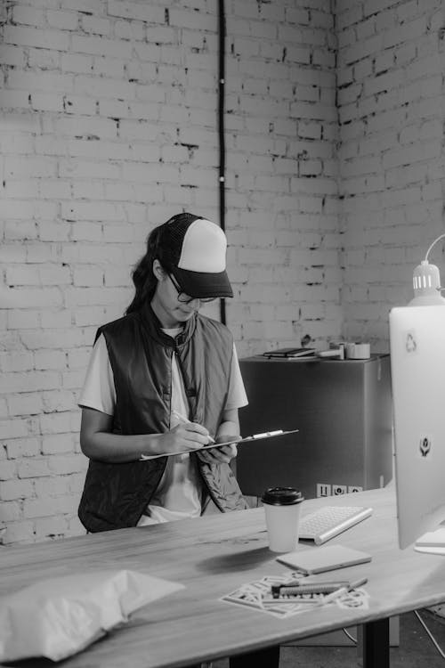 Female Employee holding a Clipboard