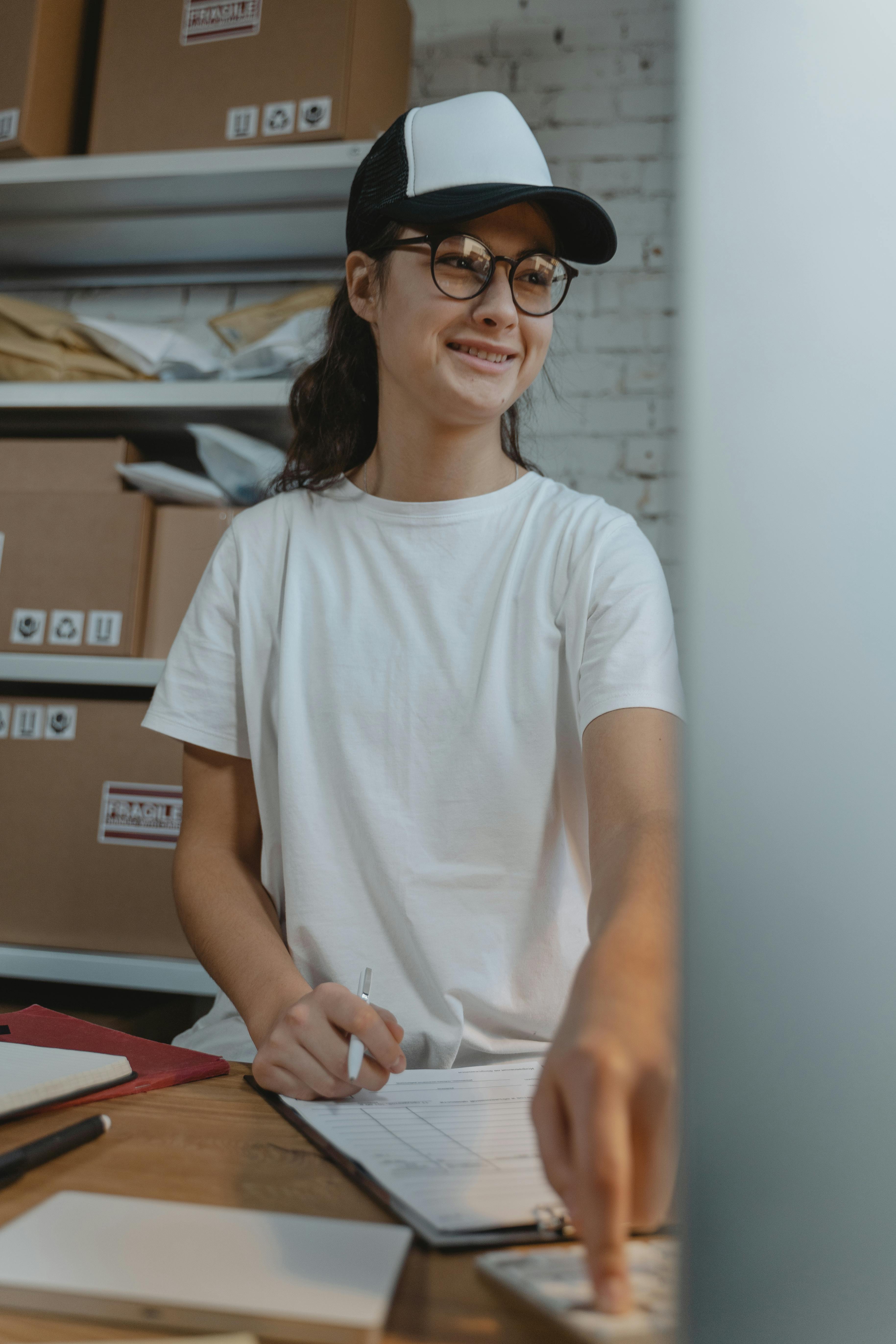 woman in white crew neck t shirt wearing black eyeglasses