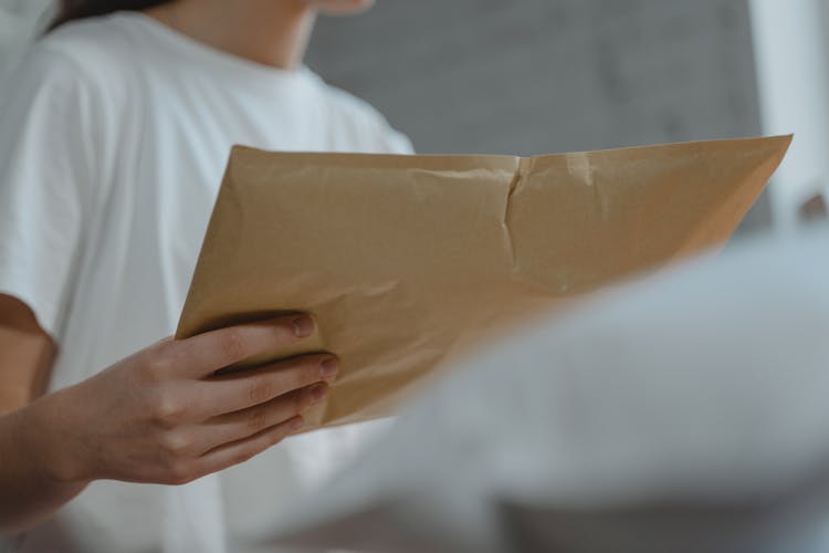 Close-up Photo Of Person Holding A Parcel 