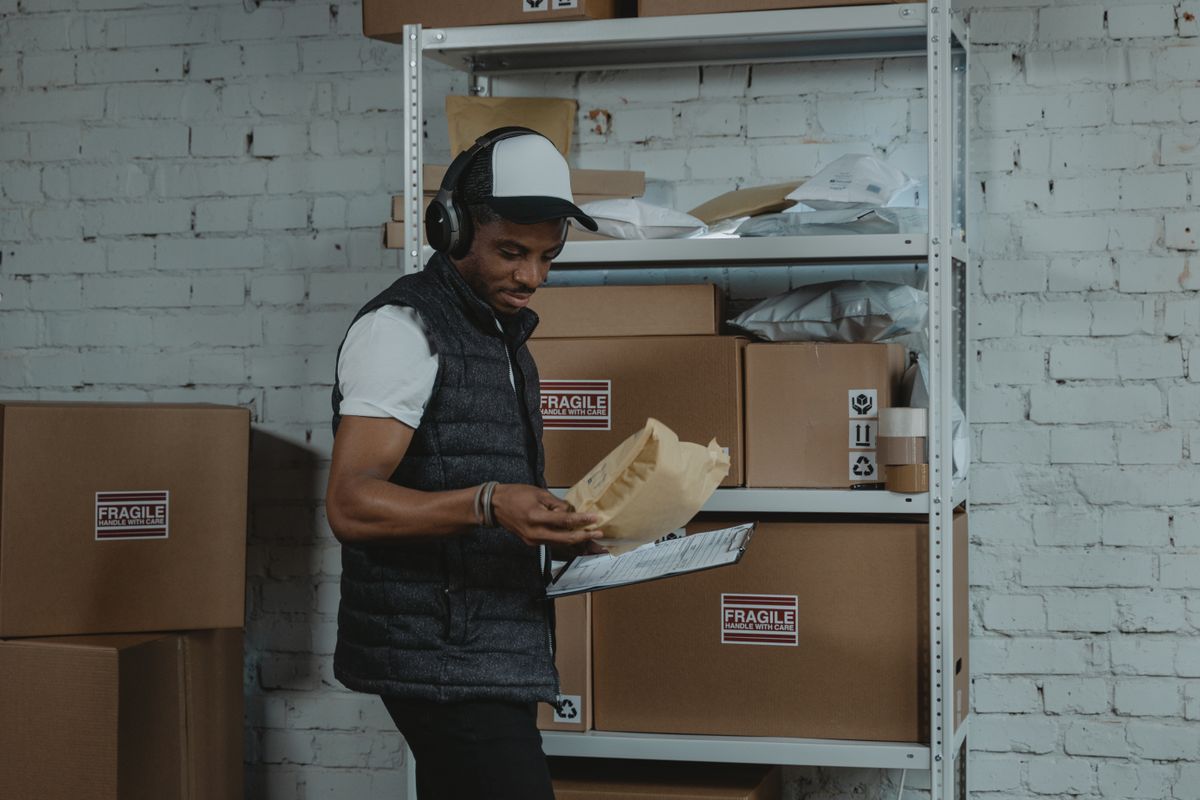 Warehouse worker sorting packages