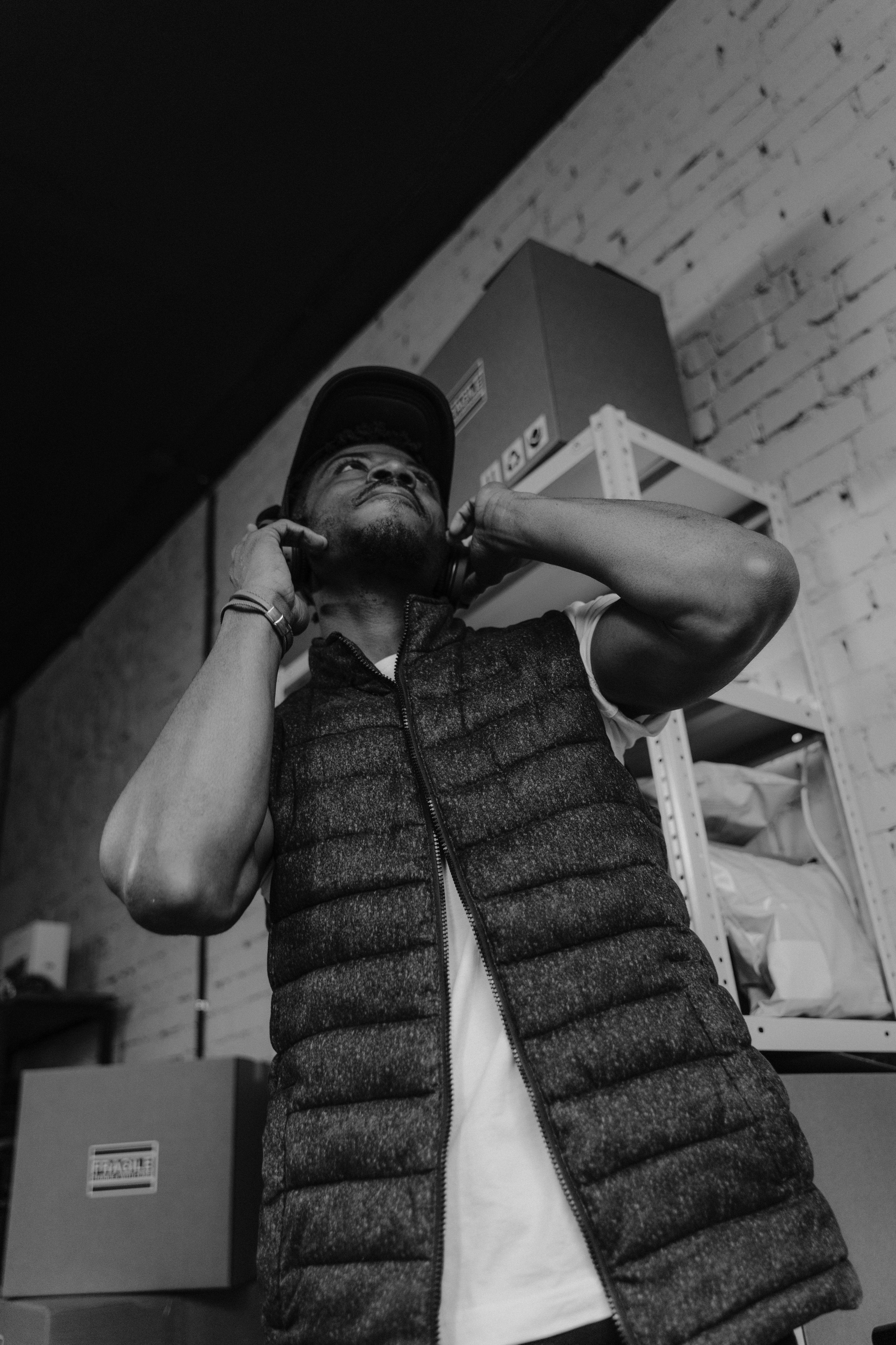 Man Wearing a Vest and Shirt Standing · Free Stock Photo