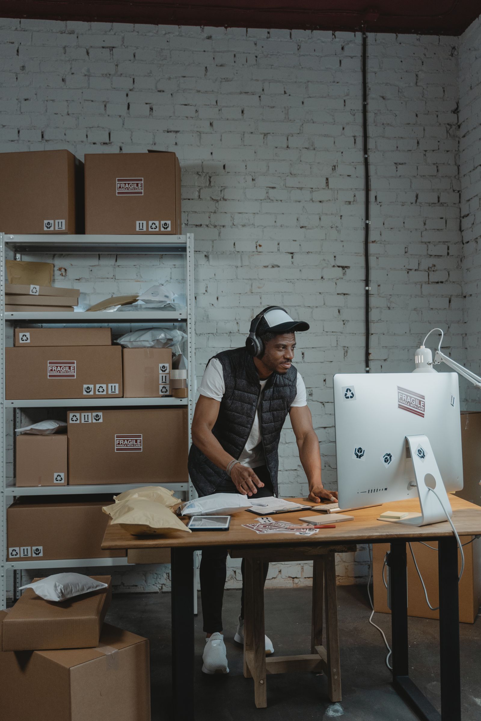 Warehouse worker packing e-commerce orders for dispatch
