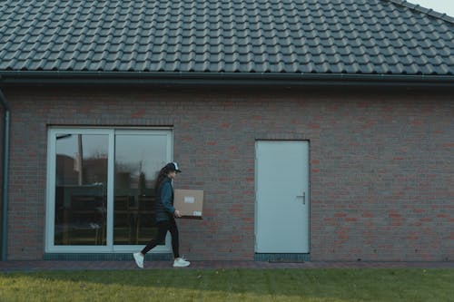Delivery Woman carrying a Box
