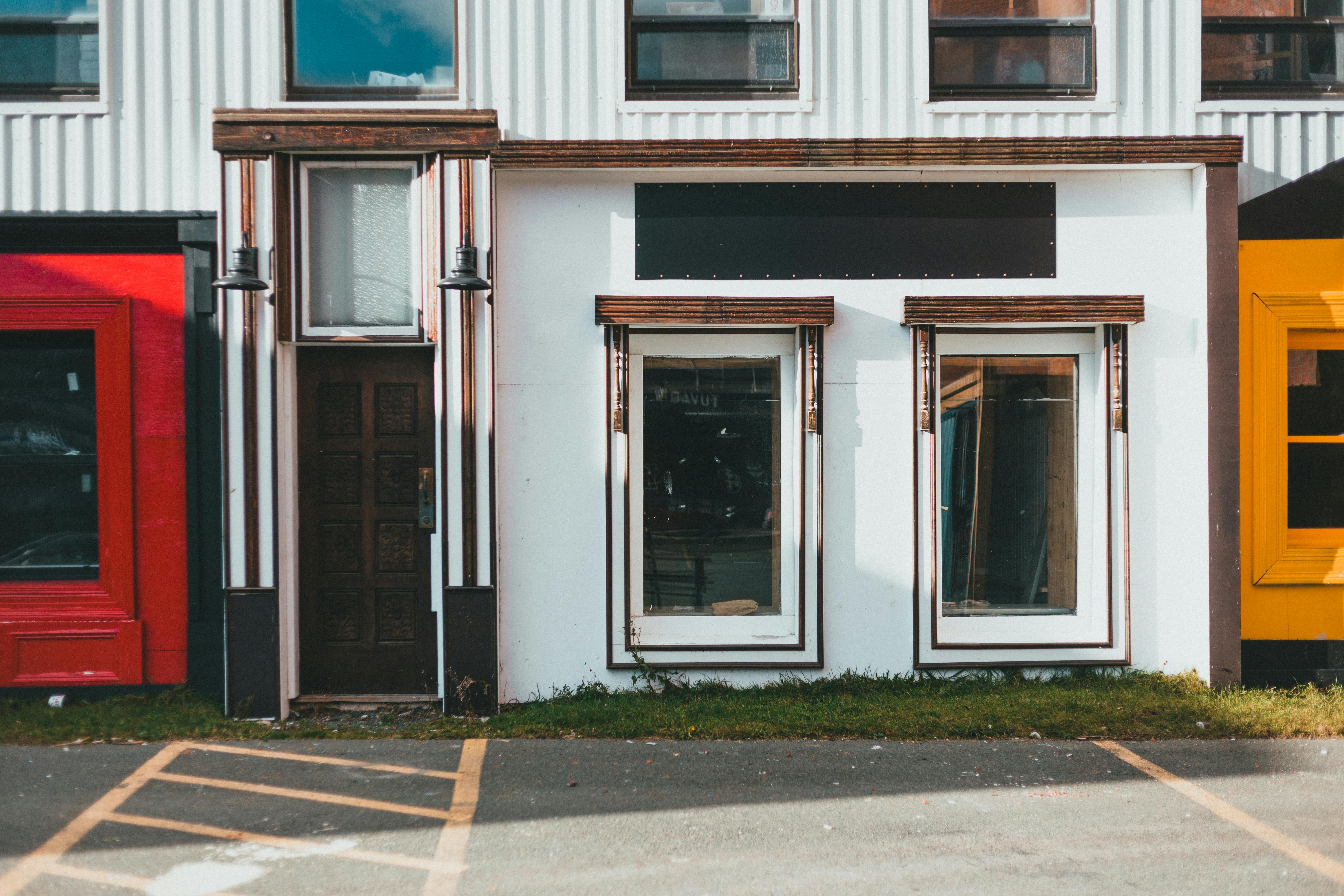 Business owner arranging products on a modern metal display rack in Los Angeles