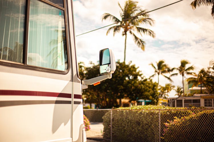 Selective Focus Photo Of Side Mirror Of A Van 