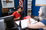 Female Leader looking at a Document