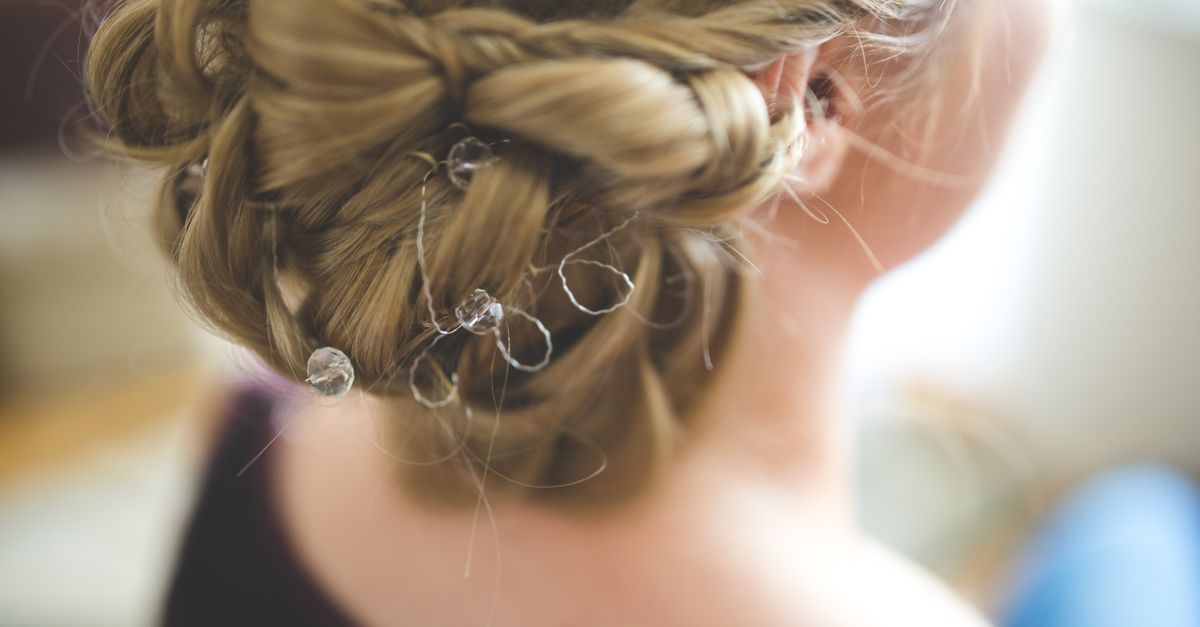 Close-up of an elaborate bridal hairstyle decorated with delicate crystals, perfect for wedding day inspiration.