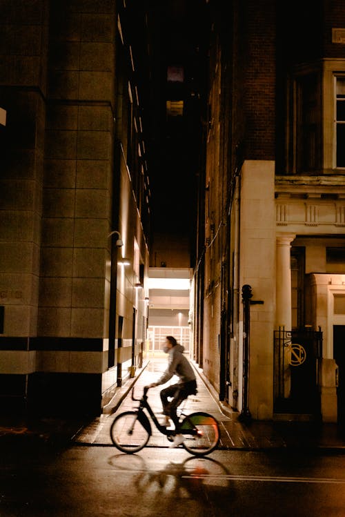Man riding bicycle on street in city