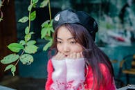 Young Woman in Headwear Thinking