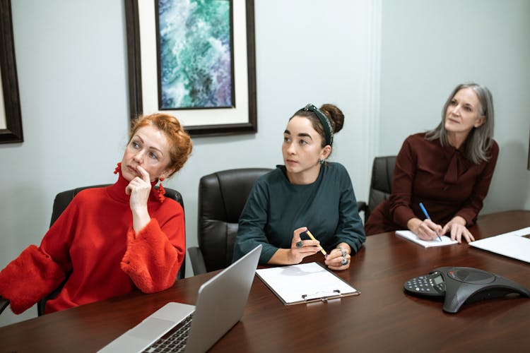 Women Sitting In A Conference Room