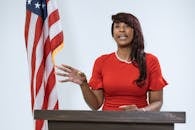 Woman Standing on a Podium