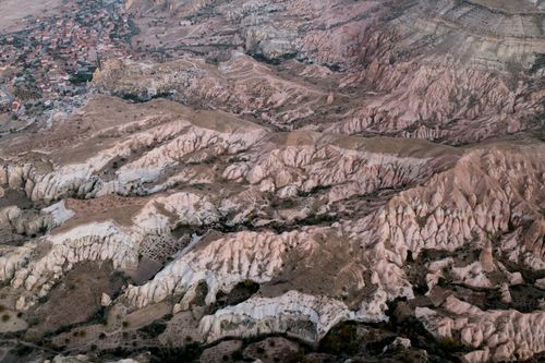 Free A breathtaking aerial shot of Cappadocia's distinct rock formations, showcasing nature's artistry. Stock Photo