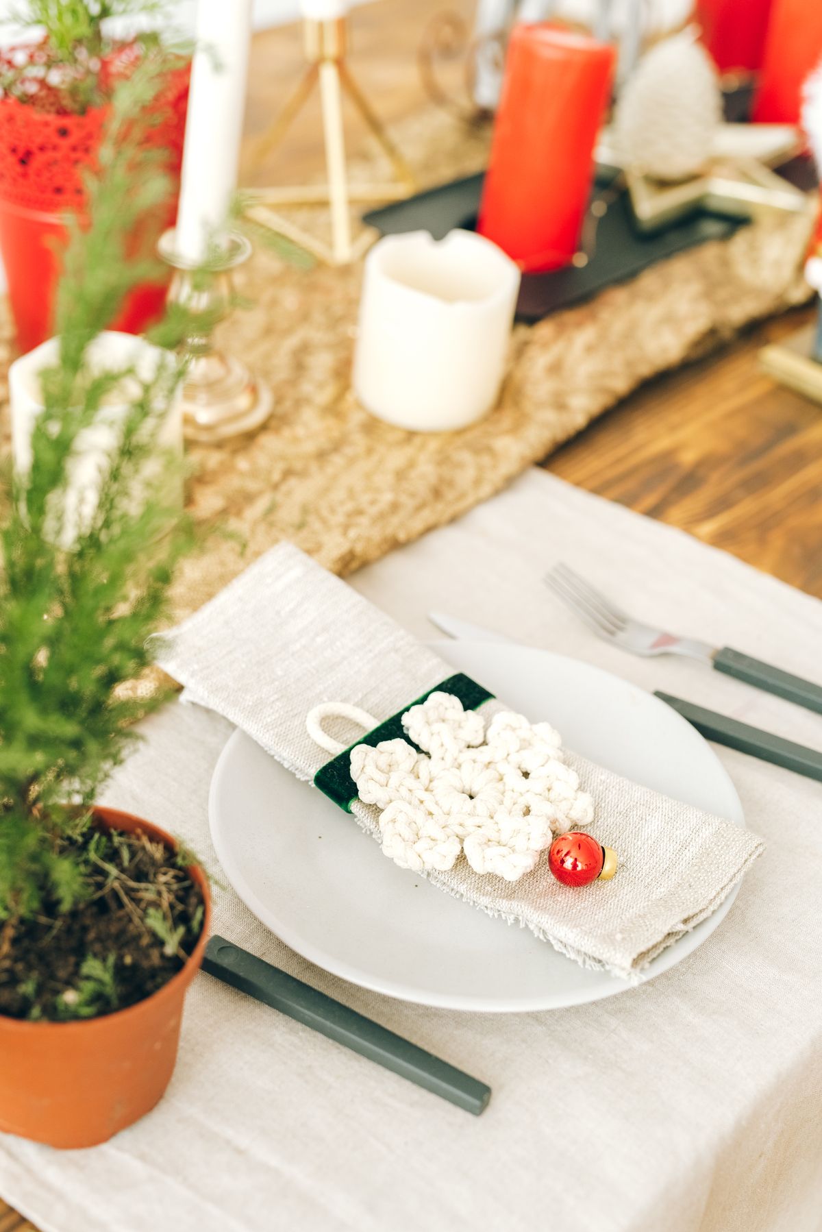 Star-shaped folded napkin on a festive table with snowflake details