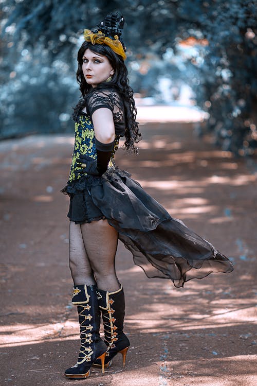 Woman in Black Dress and Black Boots