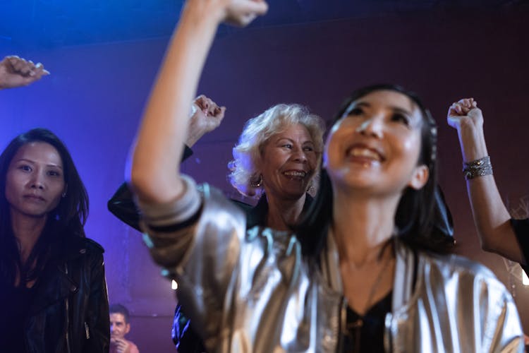 Women Smiling And Dancing In A Night Club