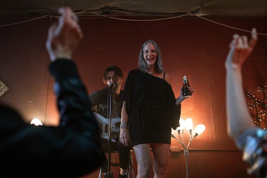 A lively nightlife scene featuring a singer and guitarist on stage entertaining an enthusiastic crowd.