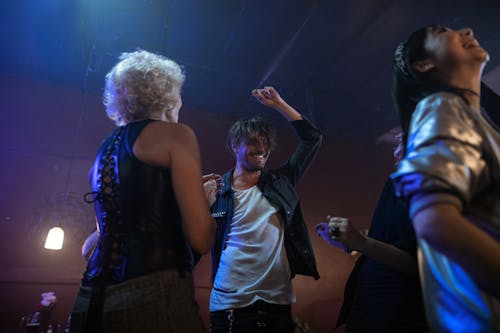 Free People Dancing Together in the Club Stock Photo