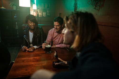 Friends Sitting Together at a Bar