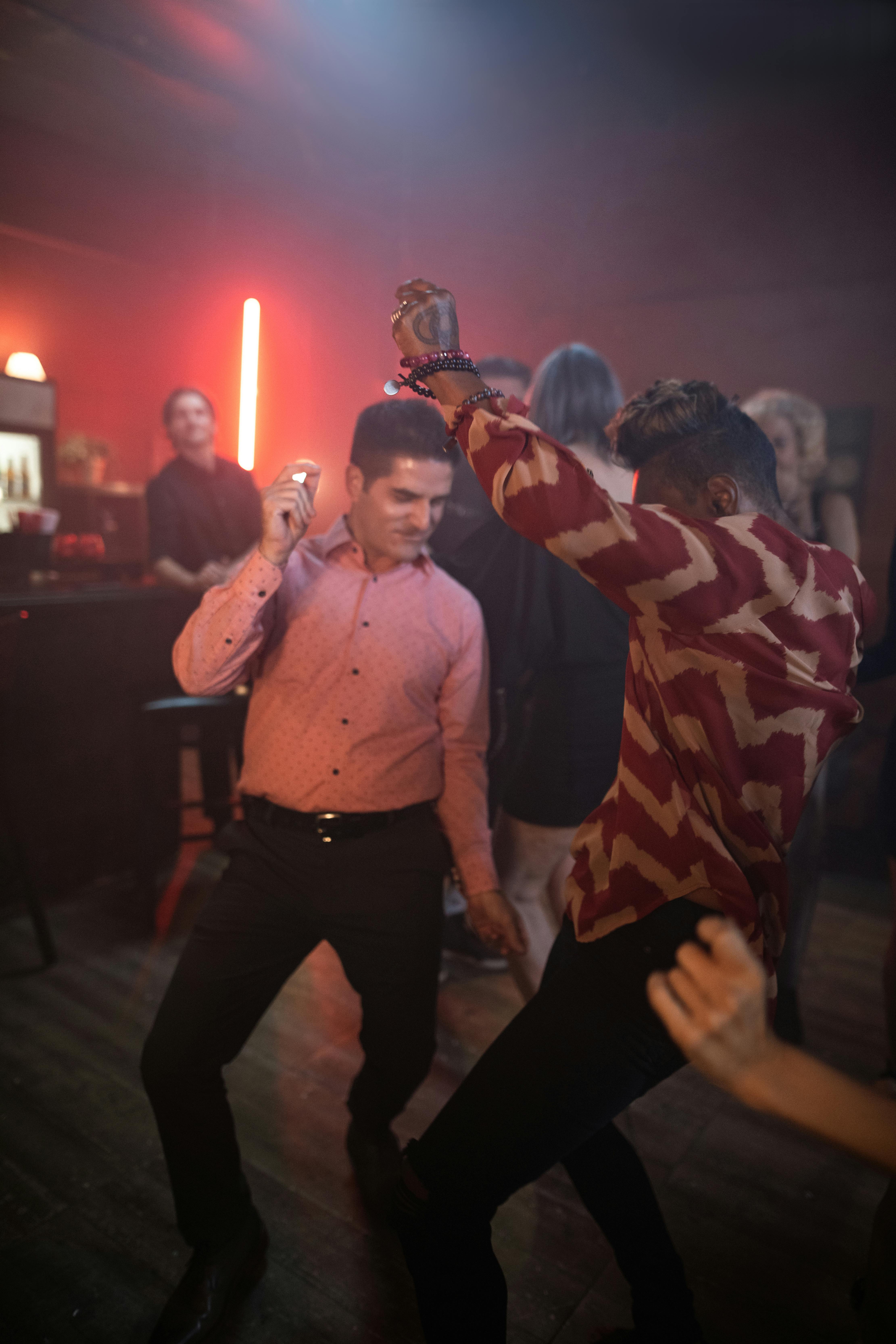 people dancing in a bar