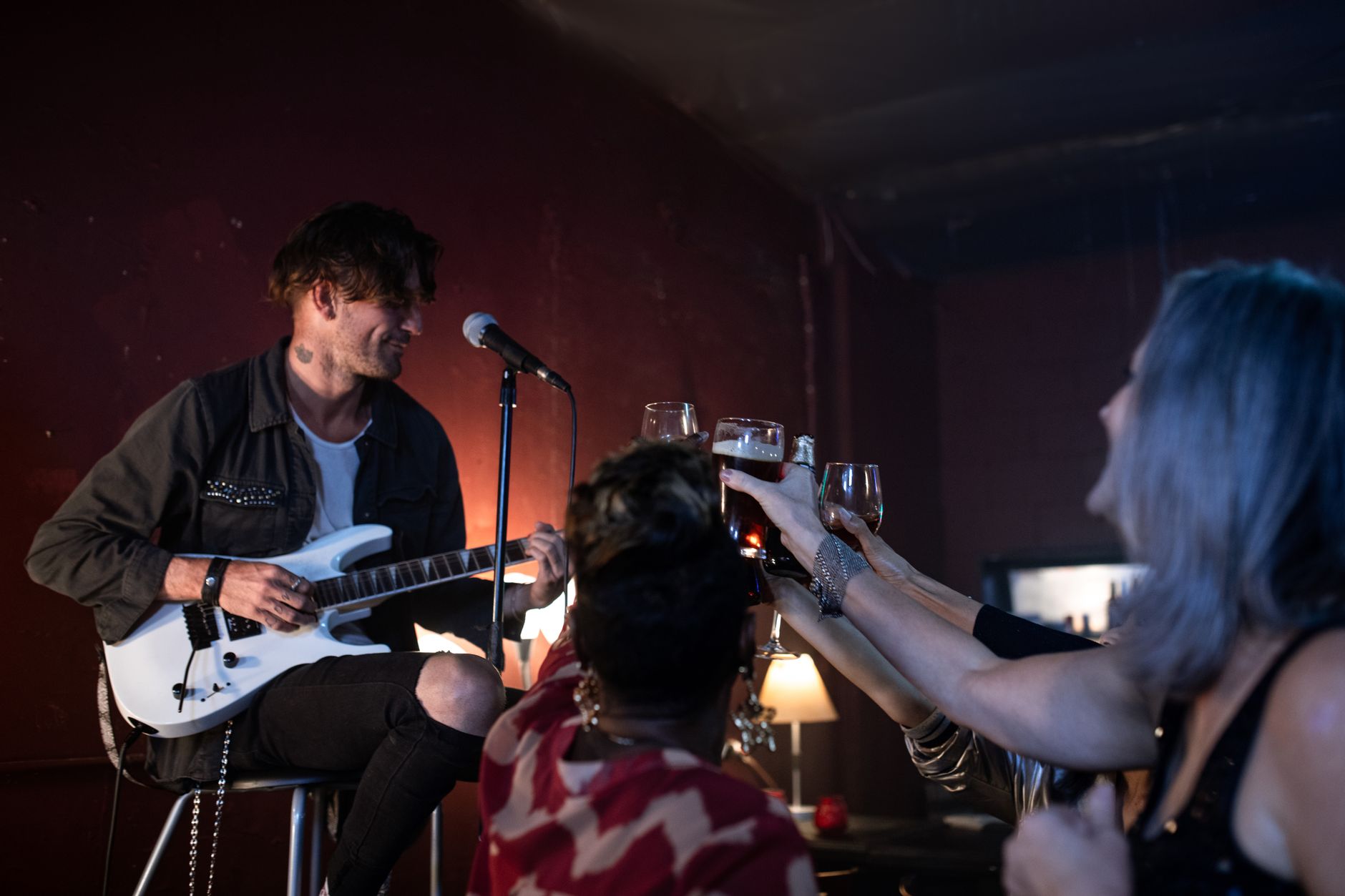 Live music in a packed bar, showing the kind of layered night trade that gives a strip life
