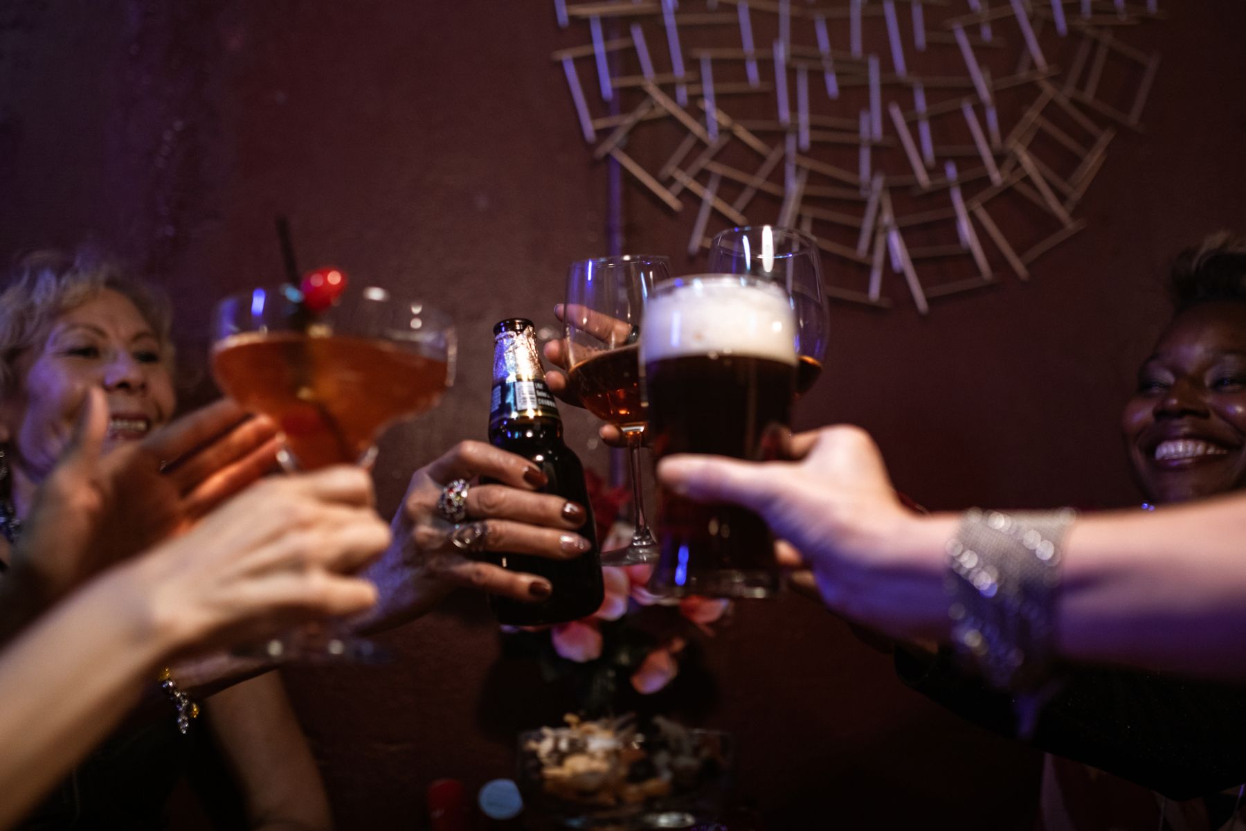 Friends raising drinks during a night out