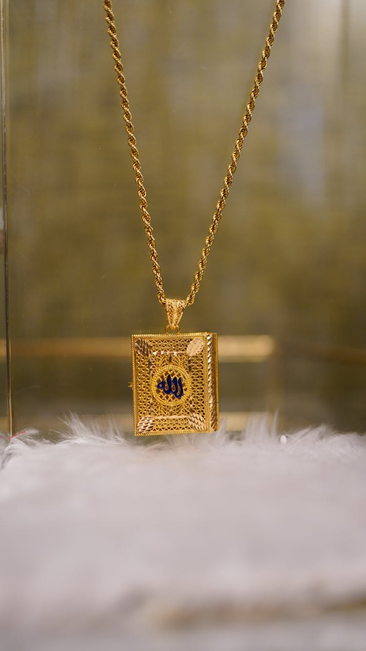 A Gold Necklace On Display