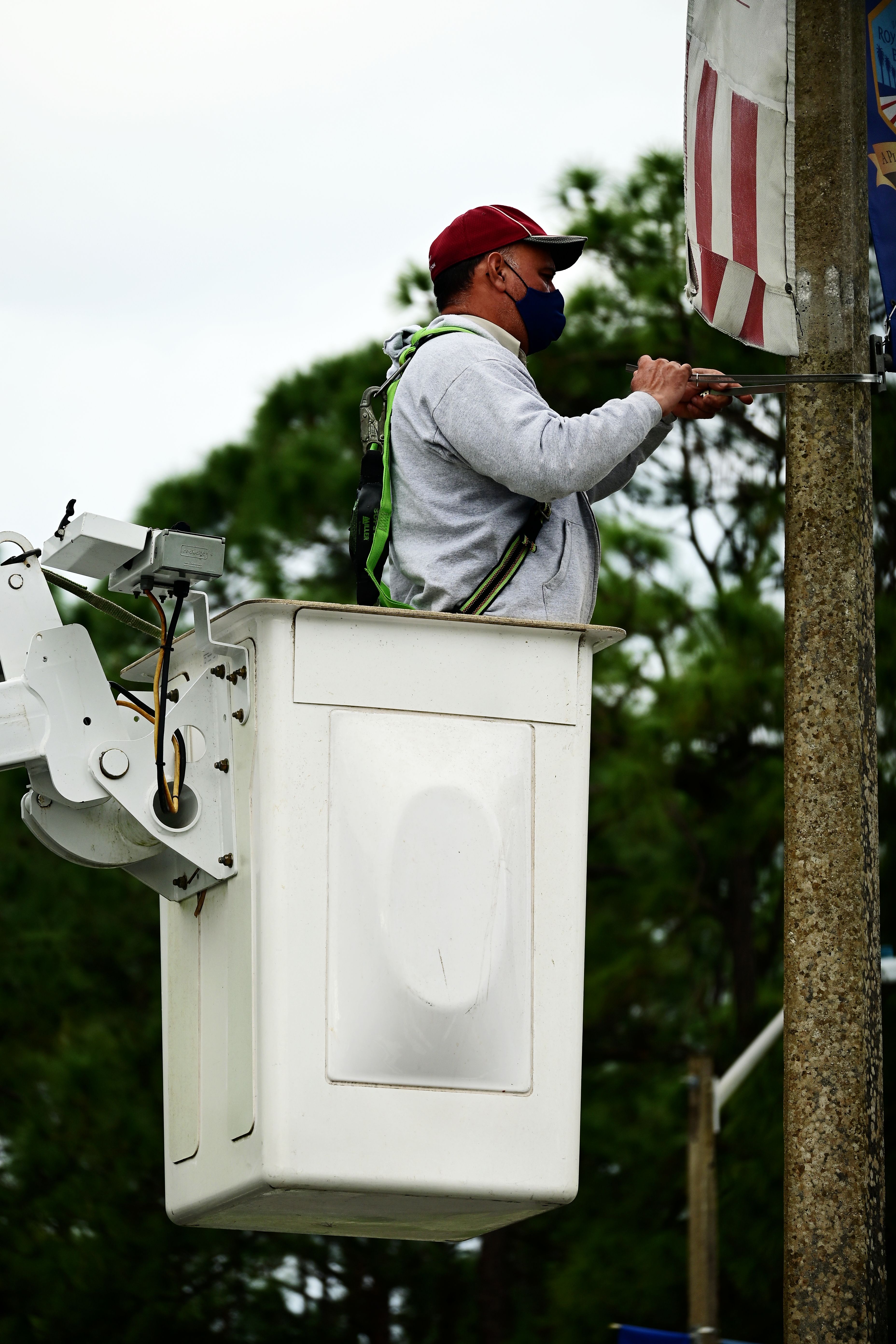 Utility worker repairing power lines