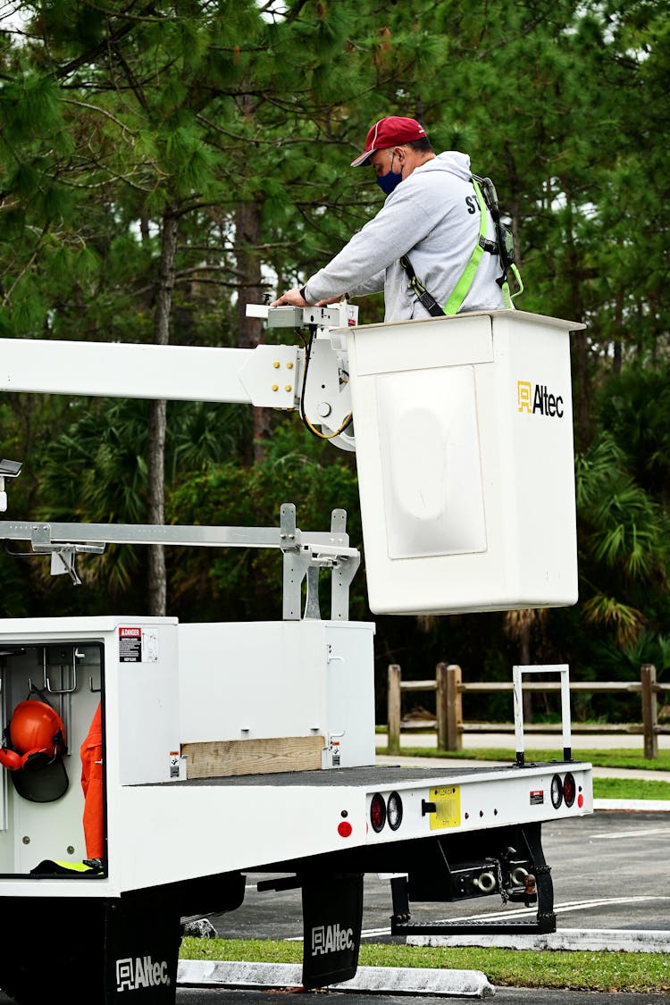 A Man On A Bucket Truck