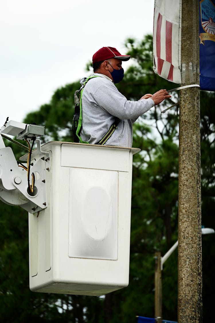 A Worker On A Bucket Truck