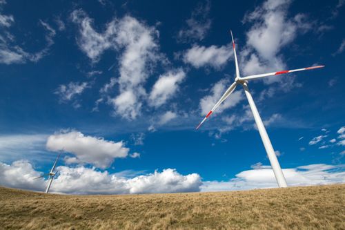 Free Wind turbines under a vibrant blue sky, showcasing renewable energy in Ordu, Turkey. Stock Photo