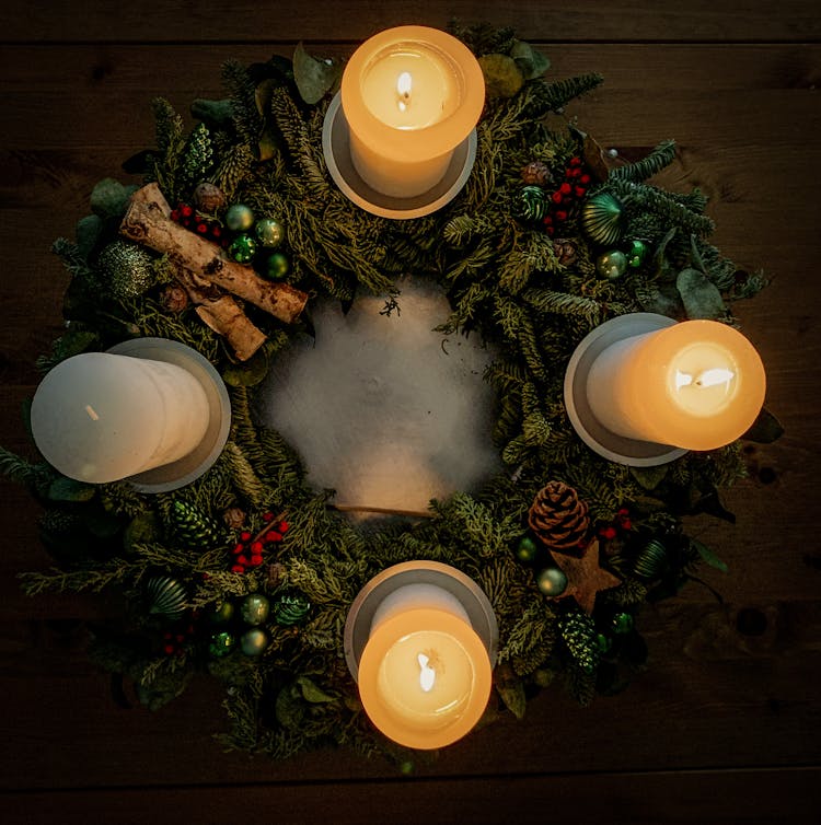 Christmas Wreath With Candles On Table