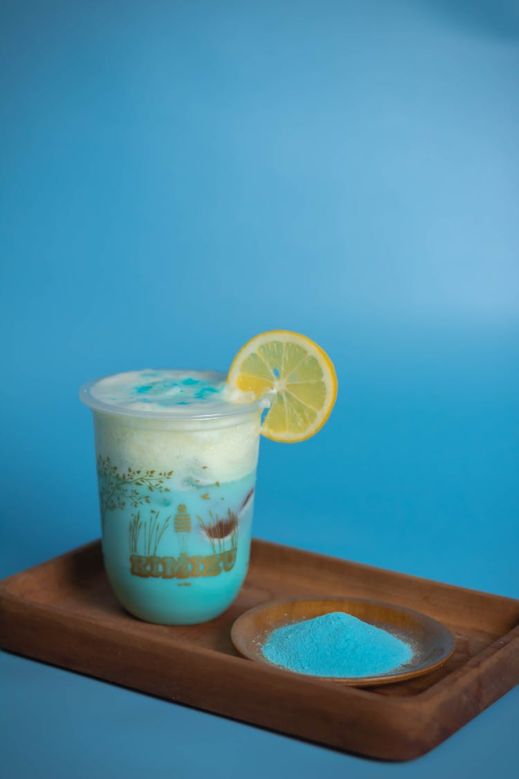 Refreshing Cold Blue Mocktail Garnished With Lemon Slice