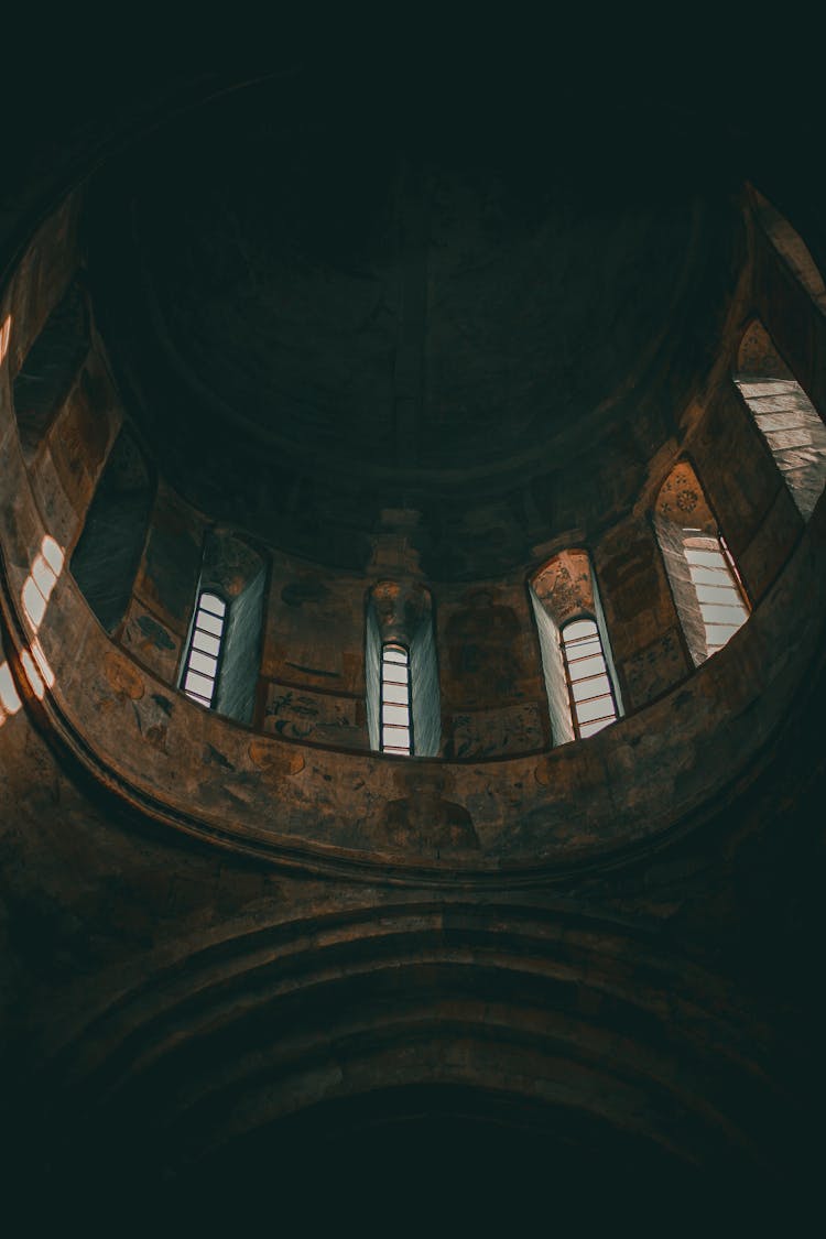 Aged Cathedral Interior With Ornamental Windows