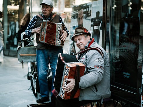 Free Men Playing Their Accordions Stock Photo