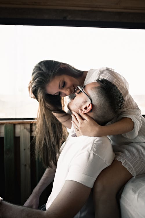 Beloved young couple cuddling and looking at each other