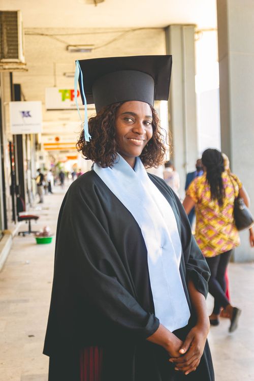 Free Young graduate in cap and gown smiling confidently in Luanda. Stock Photo