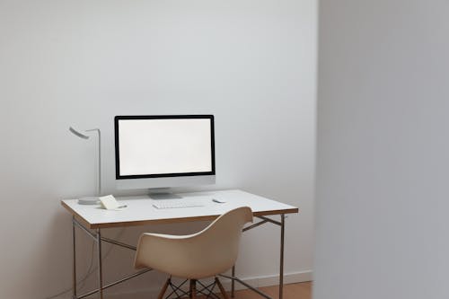 Modern workplace with computer and notepad