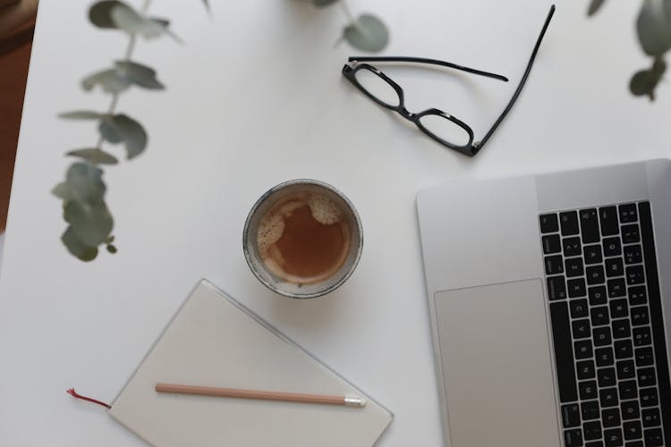 Laptop And Coffee On White Table