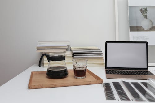 Workspace of photographer with laptop and coffee