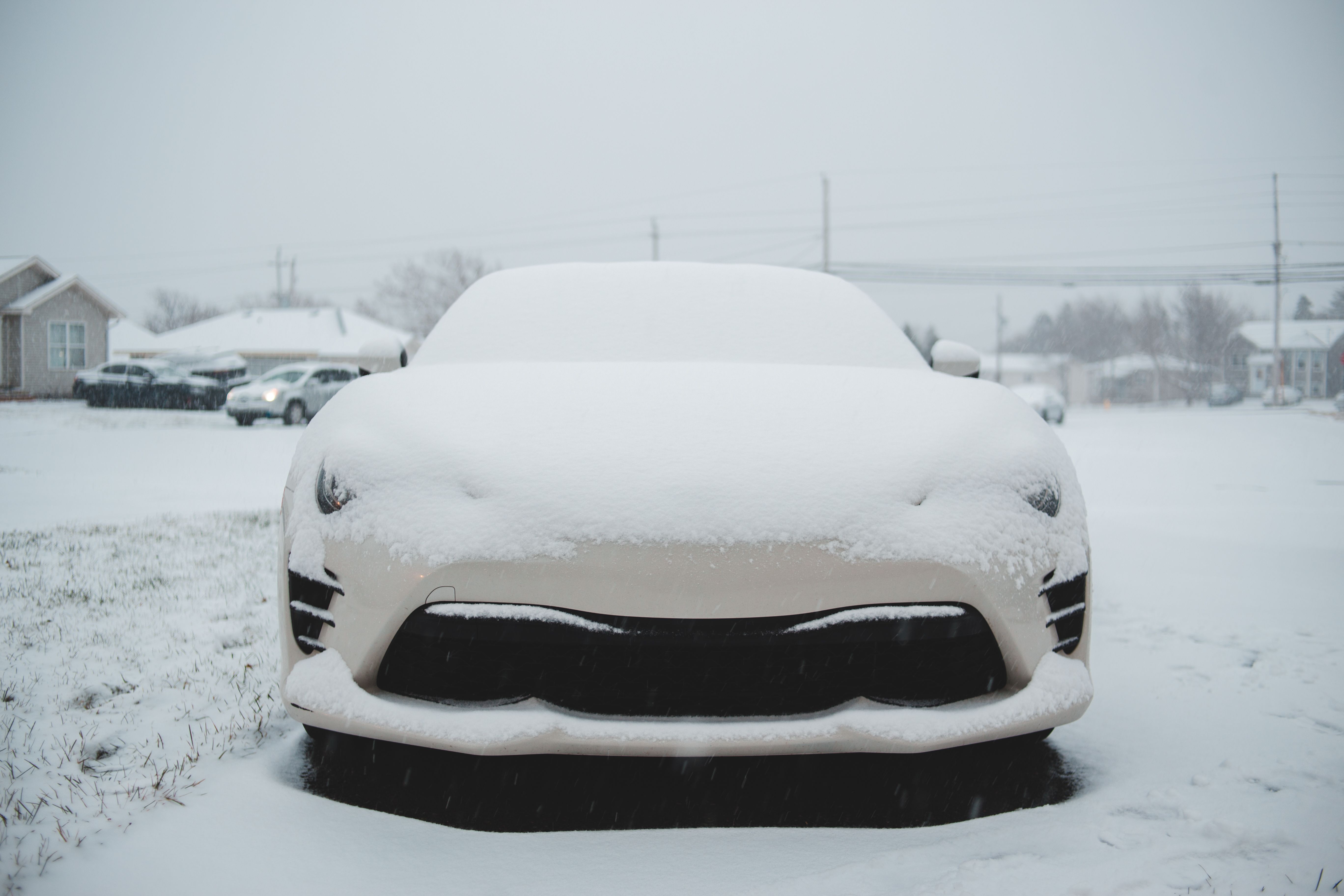 Car covered with snow parked in town · Free Stock Photo