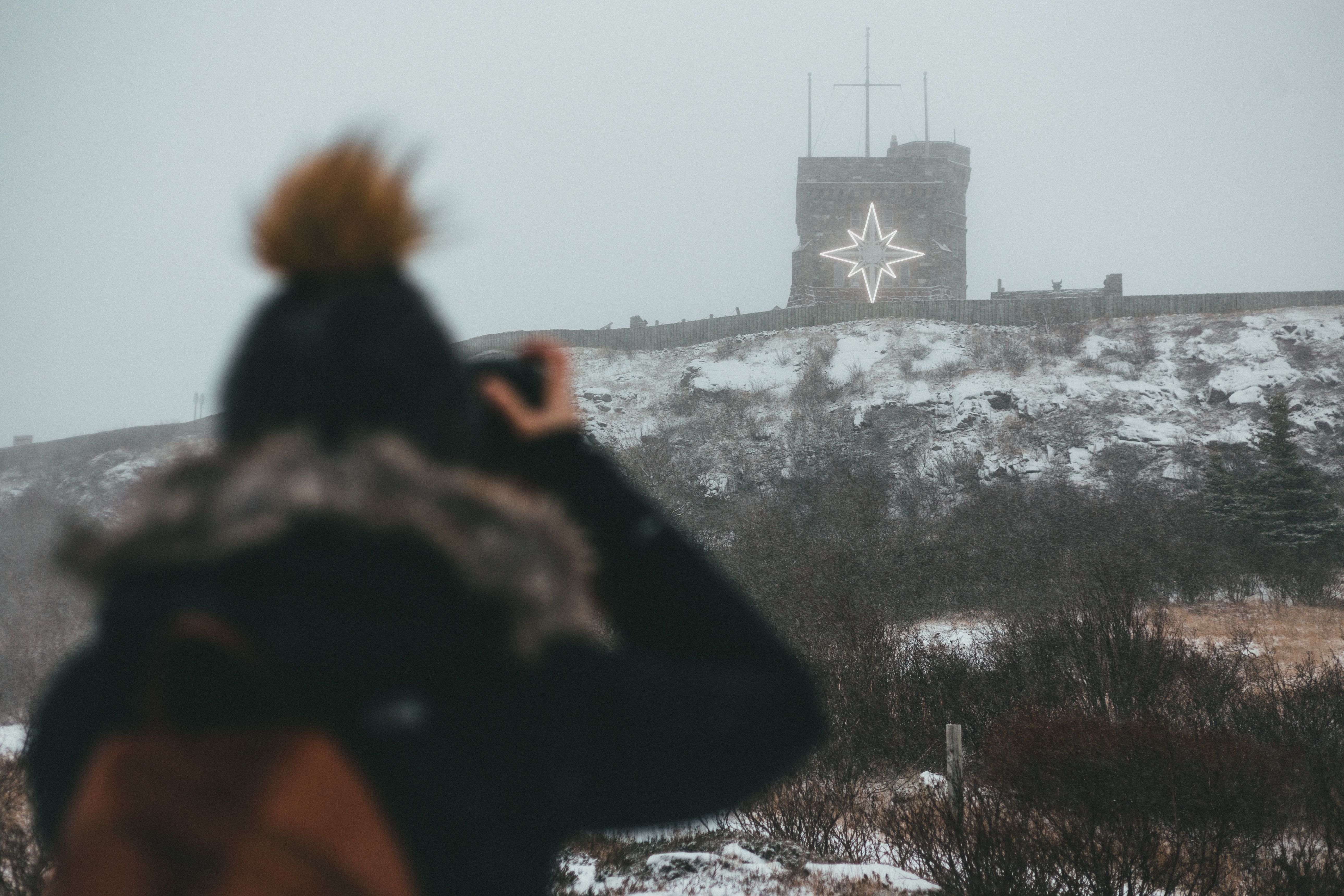 Back View of a Person Taking a Photo · Free Stock Photo