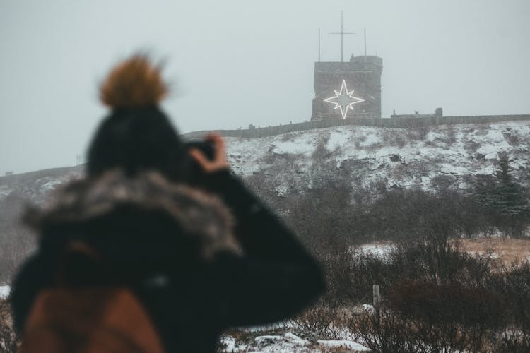 Back View Of A Person Taking A Photo 