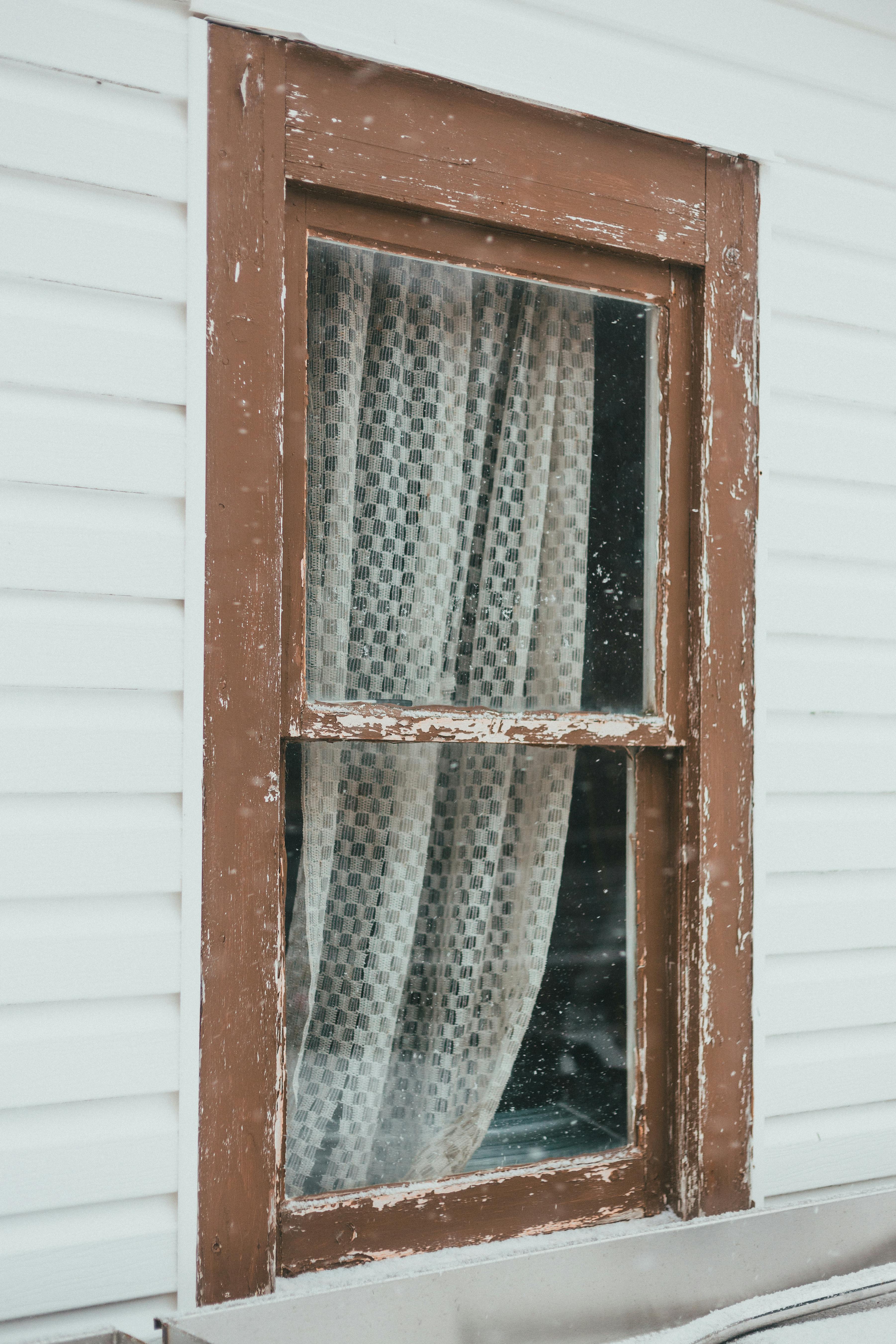 window with curtain of old house
