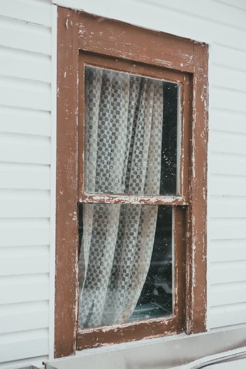 Window with curtain of old house