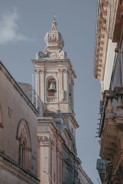 Free Vertical view of a baroque bell tower in Mdina, Malta, showcasing intricate architecture. Stock Photo